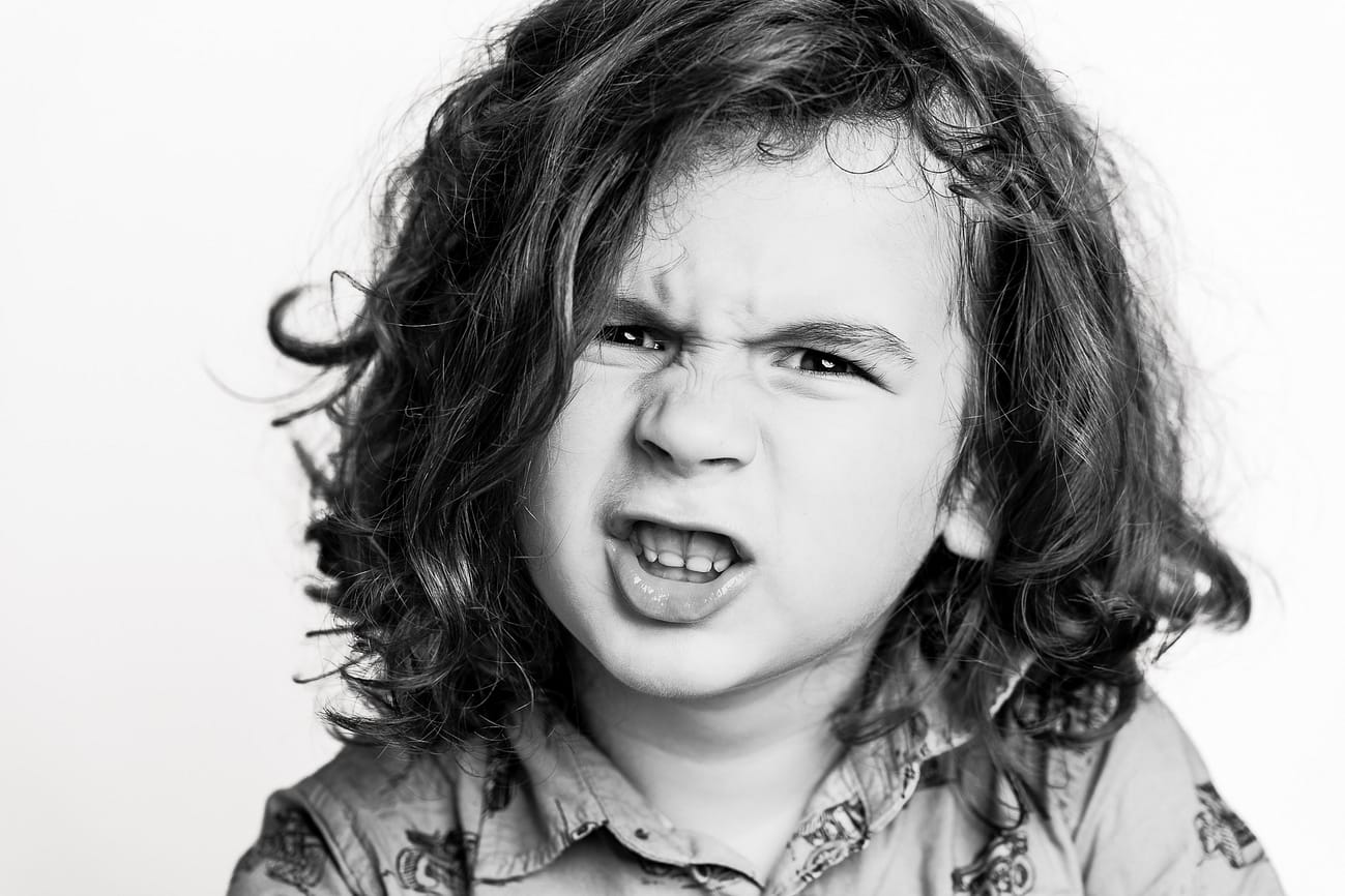 Black and white personality portrait of a child photographed in Cleveland