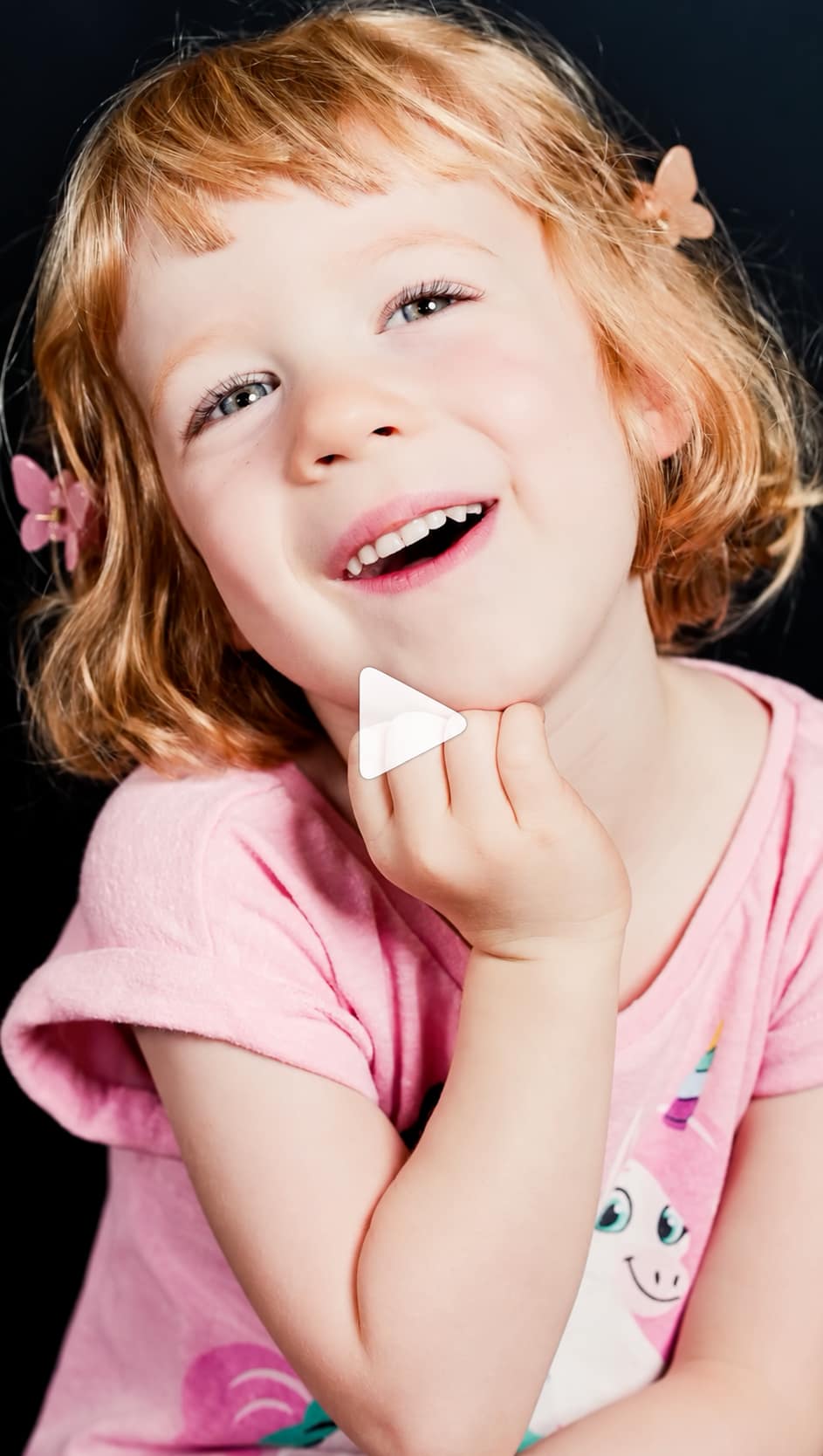 Joyful Toddler Portrait with Play Button